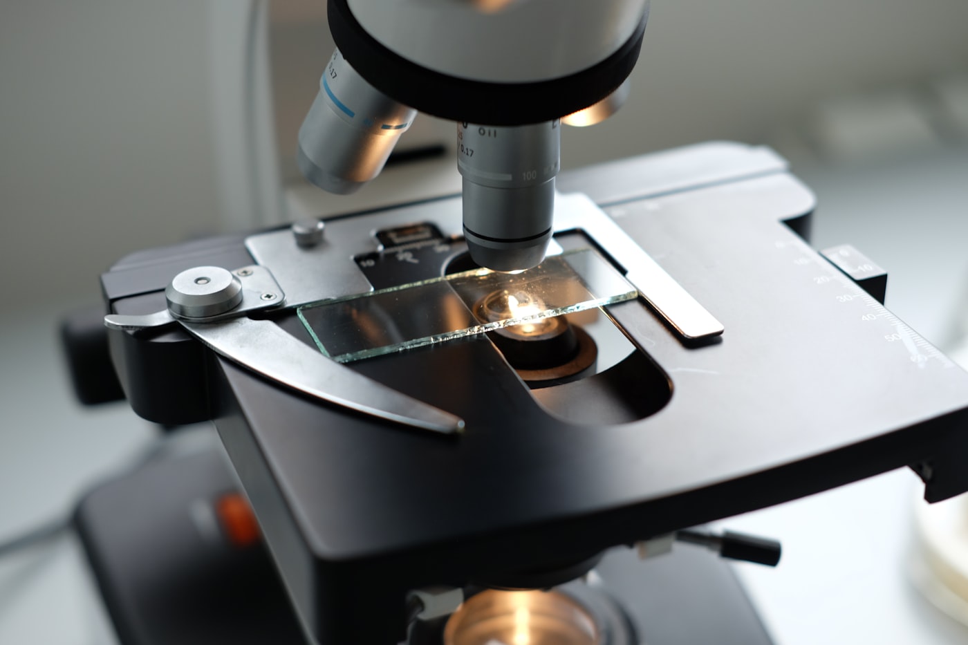 Microscope examining a sample slide in a research laboratory