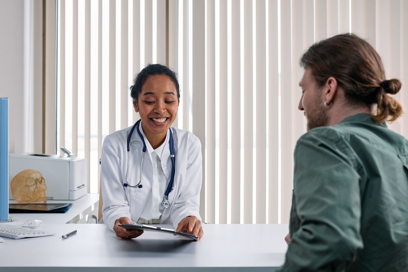 Physician reviewing study protocol with a patient